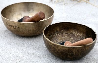 Singing bowl with mallet at the beach