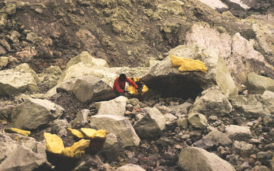 High angle view of woman on cobblestone