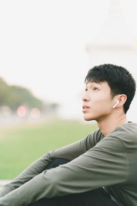 Portrait of man sitting outdoors