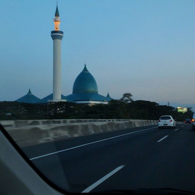 transportation, car, road, architecture, land vehicle, building exterior, built structure, clear sky, mode of transport, street, road marking, travel, city, guidance, travel destinations, dome, traffic, on the move, the way forward, copy space