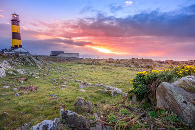 Scenic view of land against sky during sunset