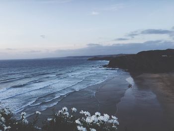 Scenic view of sea against cloudy sky