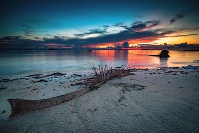 Scenic view of sea against sky at sunset