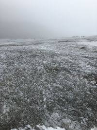 Scenic view of landscape against sky during winter