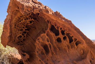 Low angle view of rock formation against sky