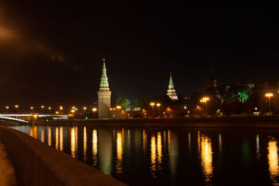 Reflection of illuminated buildings in water at night