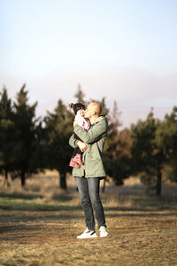 Rear view of man standing on field