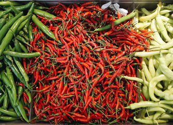 High angle view of red chili peppers for sale at market