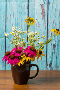 Close-up of flower vase on table