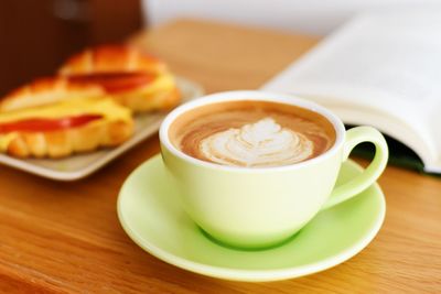 Close-up of cappuccino on table
