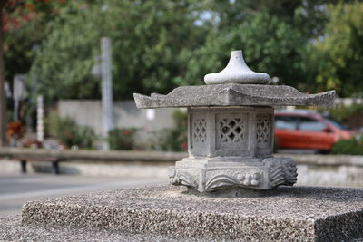 Close-up of buddha statue in garden