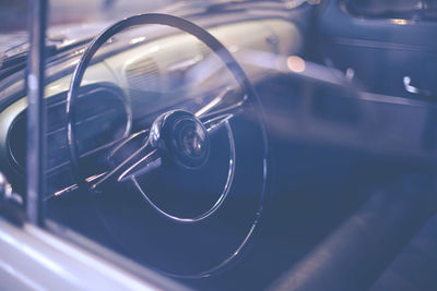 Steering wheel seen through window