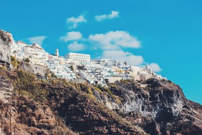 Low angle view of rock formation against sky