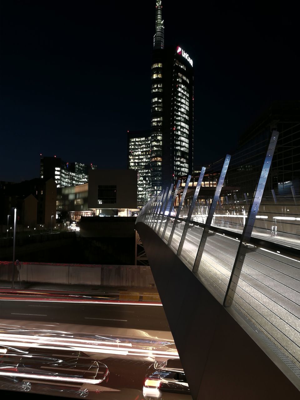 architecture, built structure, illuminated, city, night, building exterior, modern, skyscraper, sky, no people, outdoors, cityscape, staircase, water