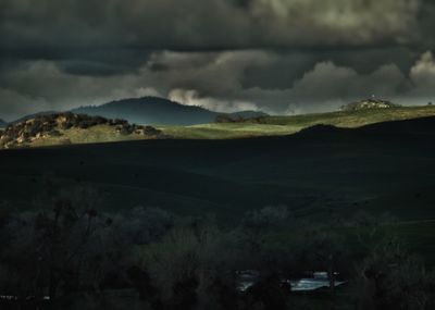 Scenic shot of clouds over mountain range