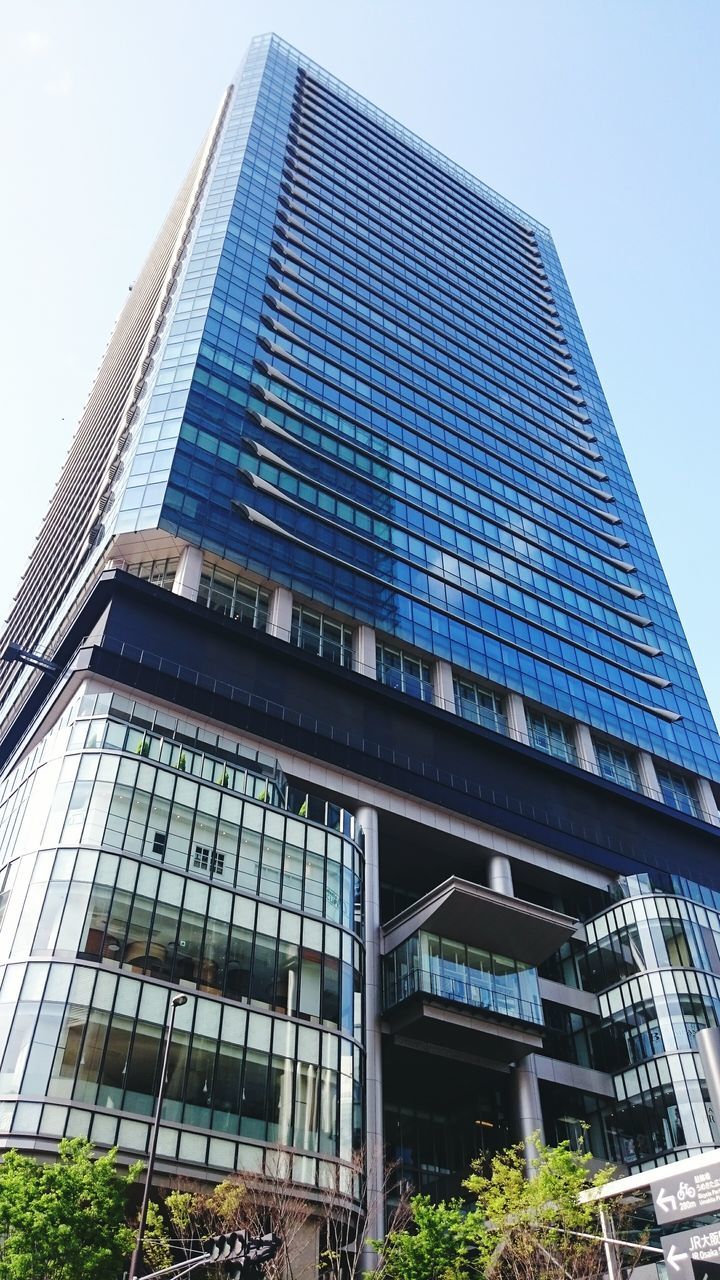 building exterior, architecture, low angle view, built structure, modern, office building, skyscraper, city, tall - high, glass - material, tower, building, reflection, clear sky, sky, tall, window, day, outdoors, city life