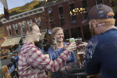 Friends having toast in bar