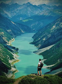 Rear view of man standing on mountain