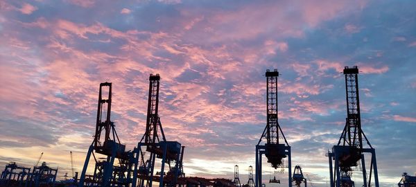 Silhouette of cranes at commercial dock