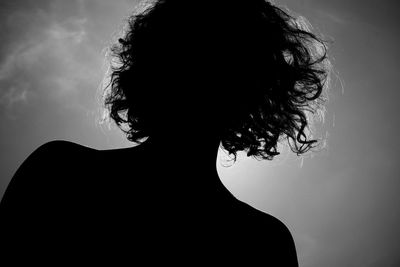 Silhouette woman against sky