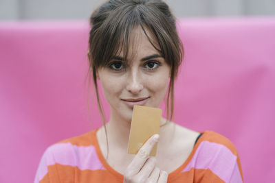 Woman holding credit card