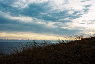 Scenic view of sea against cloudy sky