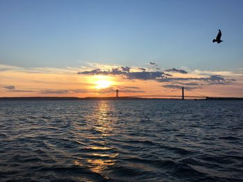 Scenic view of sea against sky during sunset