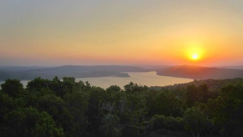 Scenic view of landscape against sky during sunset