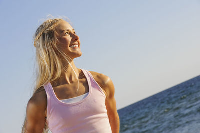 Smiling young woman looking away