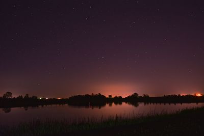 Scenic view of lake at night