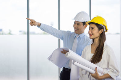 Man working with arms outstretched