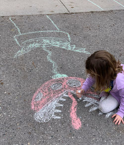 High angle view of girl standing on street