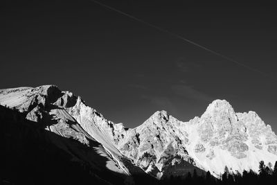 Low angle view of vapor trails in sky