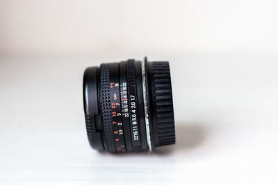 Close-up of camera against white background