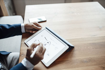 Businessman preparing strategy on digital tablet in office