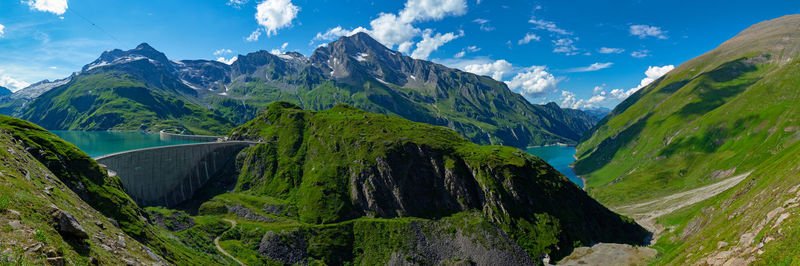 Panoramic view of green mountains against sky