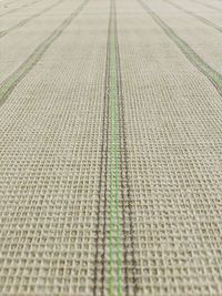 Full frame shot of tire tracks on field