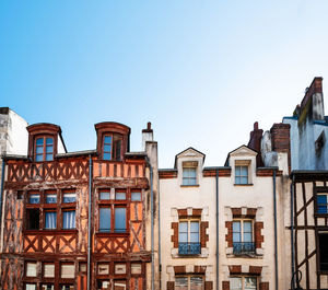 Low angle view of buildings against clear sky