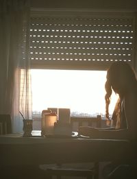 Side view of man working on table