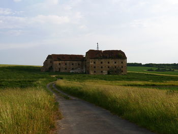 Built structure on land against sky