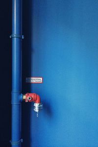 Gas pipe on blue wall