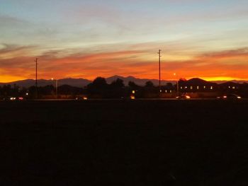 Silhouette of mountain range at sunset