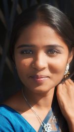 Close-up portrait of a smiling young woman