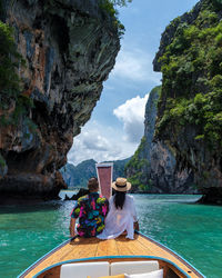 High angle view of people kayaking in sea