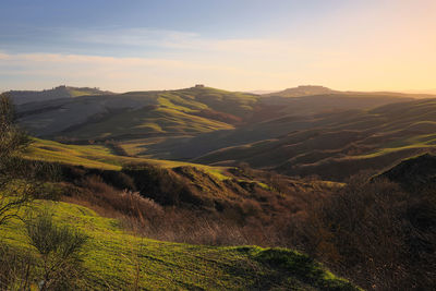 Scenic view of landscape against sky during sunset