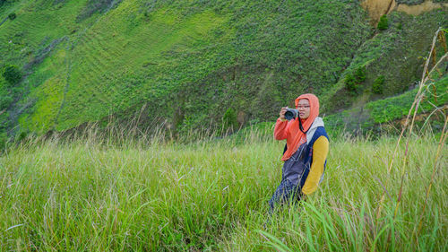 Woman standing in field