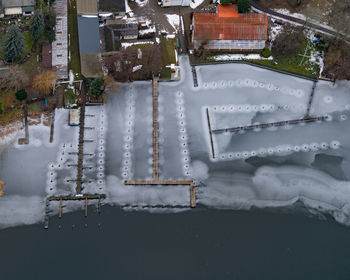 High angle view of snow covered cars on building