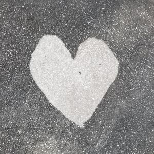 Directly above shot of heart shape made on white background