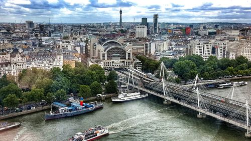 Bridge over river with city in background