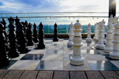 Full frame shot of chess pieces against the sky